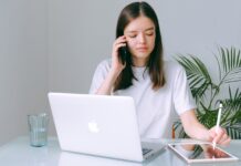 From Urban To Suburban: Why Rockville, MD, Is a Lifestyle Upgrade for High-Earning Millennials woman in white shirt working on her Macbook