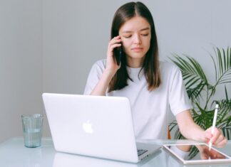 From Urban To Suburban: Why Rockville, MD, Is a Lifestyle Upgrade for High-Earning Millennials woman in white shirt working on her Macbook