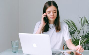From Urban To Suburban: Why Rockville, MD, Is a Lifestyle Upgrade for High-Earning Millennials woman in white shirt working on her Macbook